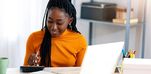 woman using calculator