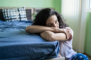 insomnia - woman awake next to bed