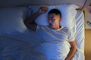 periodic limb movements - man sleeping